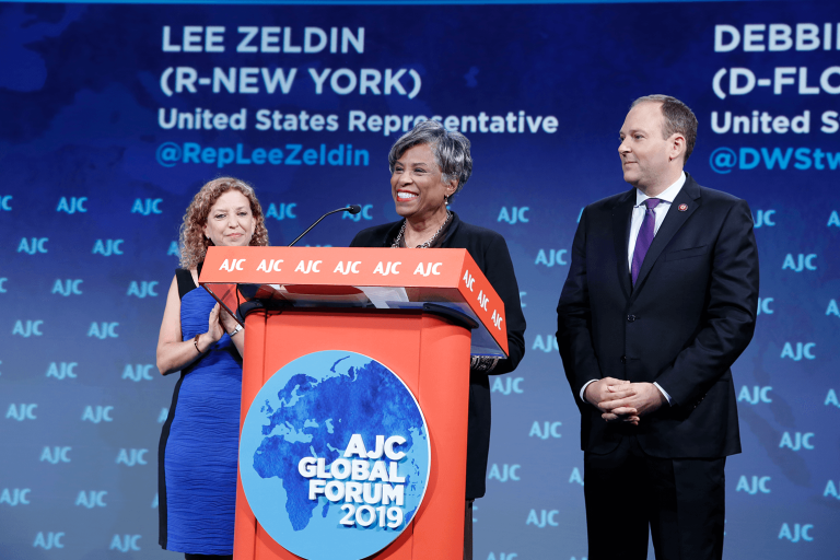 Reps. Brenda Lawrence (D-MI), Debbie Wasserman-Schultz (D-FL), and Lee Zeldin (R-NY) speaking on AJC Global Forum 2019 stage