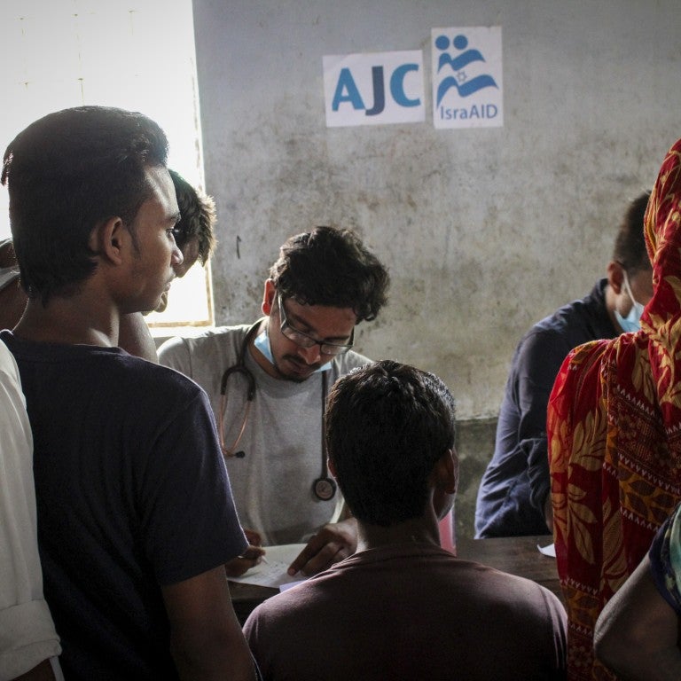 Photo of IsraAID doctors meeting with individuals in Nepal