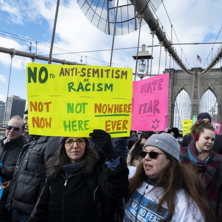 Photo of the No Hate No Fear solidarity march across the Brooklyn Bridge in NY
