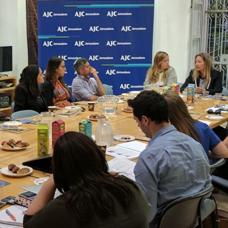 Photo of members AJC ACCESS Israel sitting down with AJC Jerusalem Director Lt. Col. (res.) Avital Leibovich